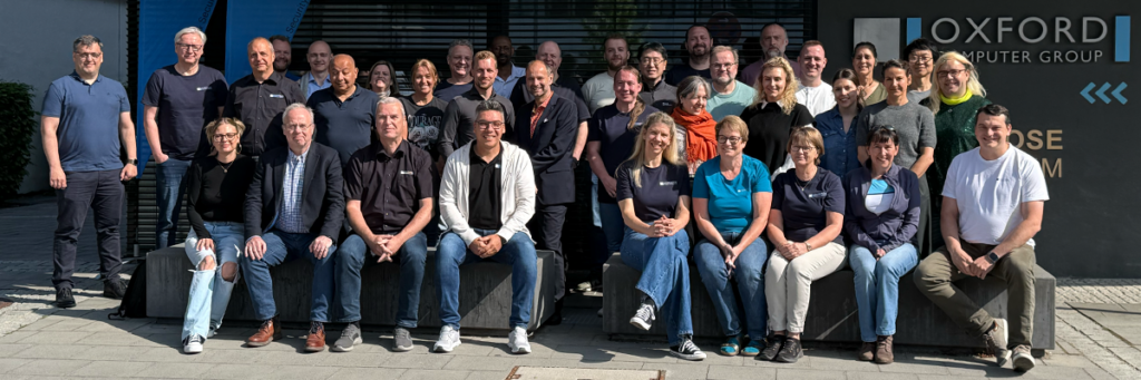 OCG Team und internationale Kolleg:innen beim Techfest 2026 vor dem Oxford Computer Group Büro in Erding