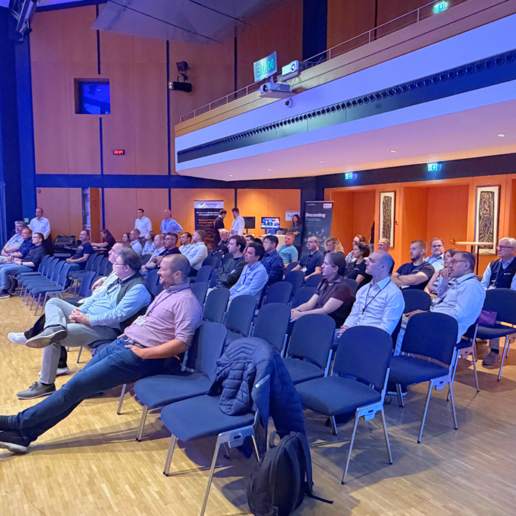 Participants at the Security & Efficiency Summit 2026 engaging in face-to-face discussions and networking in Erding