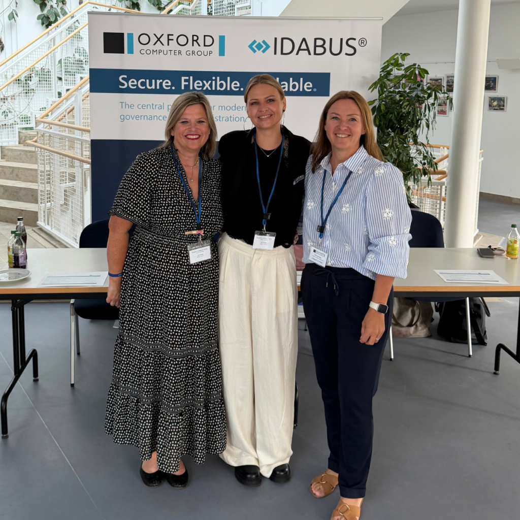 The OCG team at the reception for the Security & Efficiency Summit 2026, in front of an Oxford Computer Group and IDABUS banner