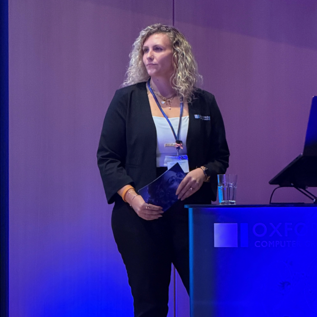 Presenter on stage at the Oxford Computer Group’s 17th Security & Efficiency Summit 2026 in Erding